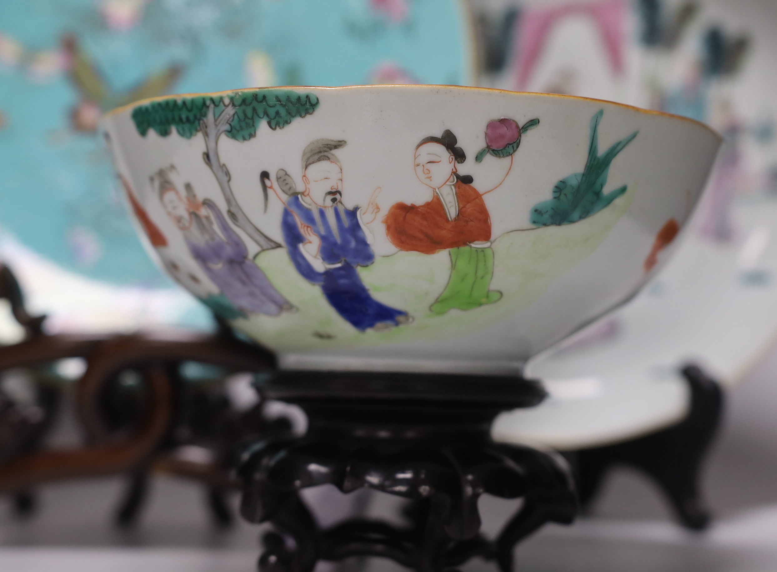 A pair of Chinese famille rose dishes painted with court scenes, a similar enamelled butterfly dish and an ‘immortals’ bowl, all 19th century